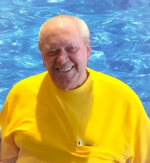 Gene Lilly Gene Lilly smiling by the pool.