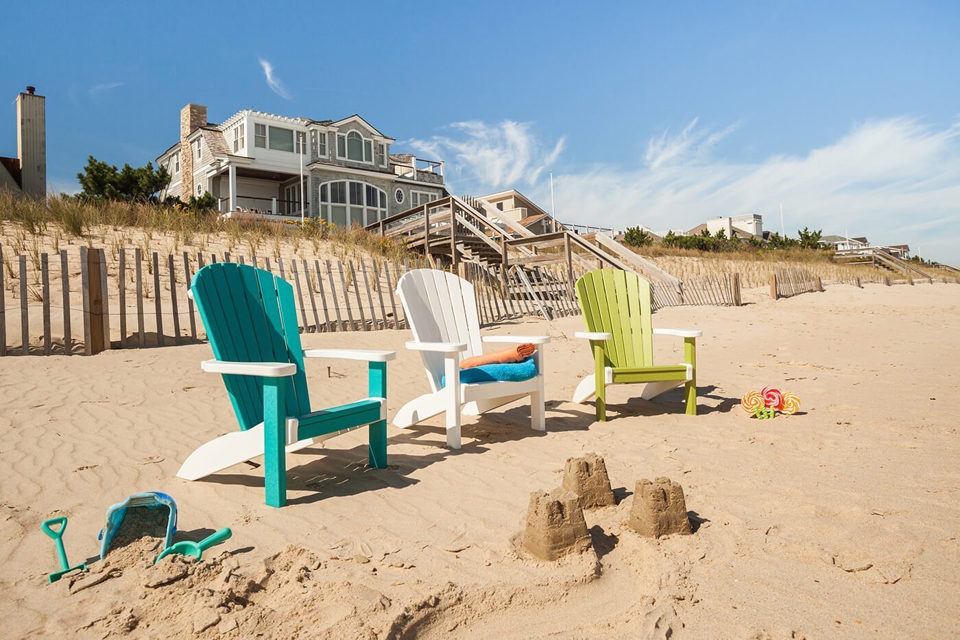 SeaAira childrens chairs Child sized chairs in multiple colors on the beach.