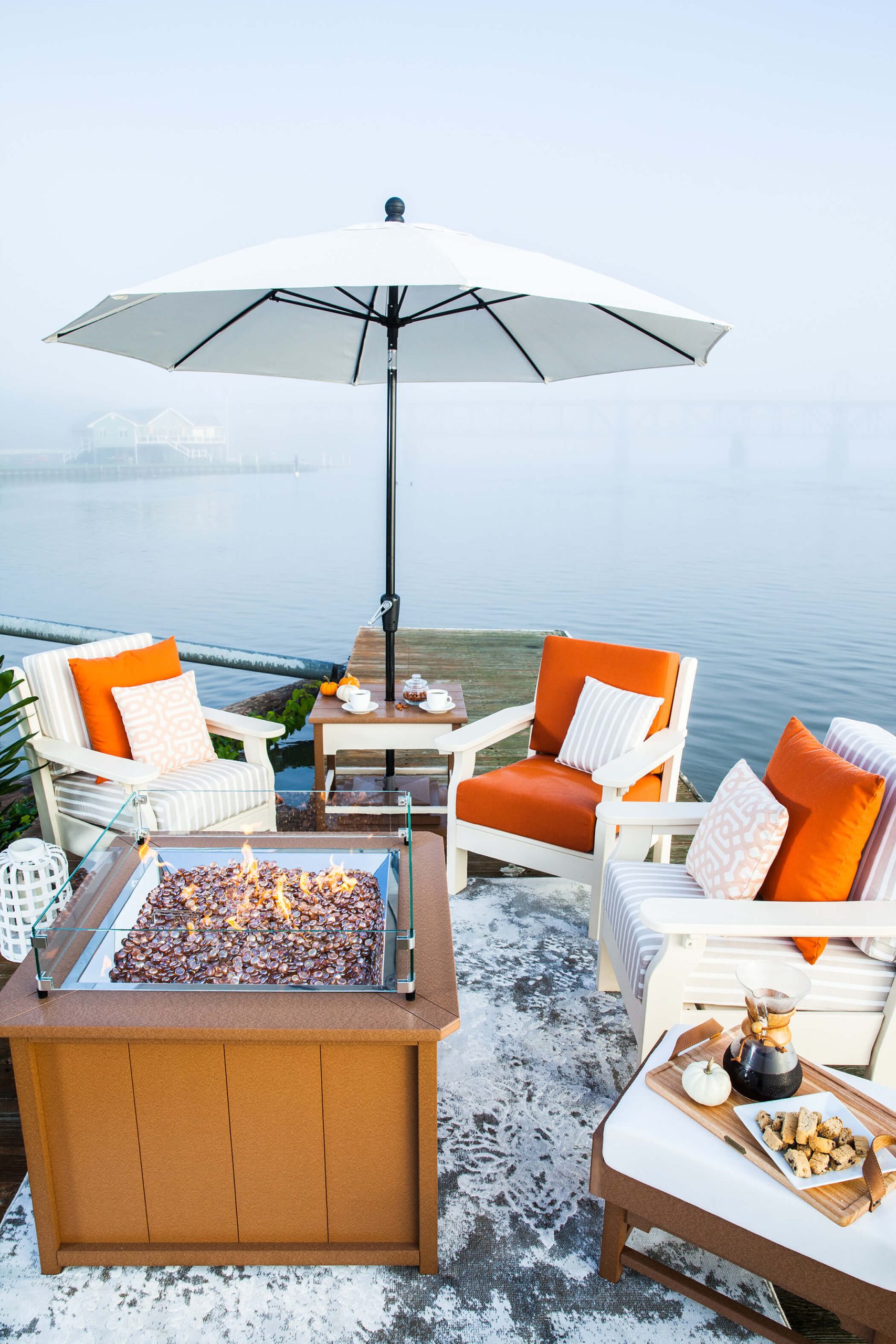 Umbrella Deep seating with a table and umbrella.