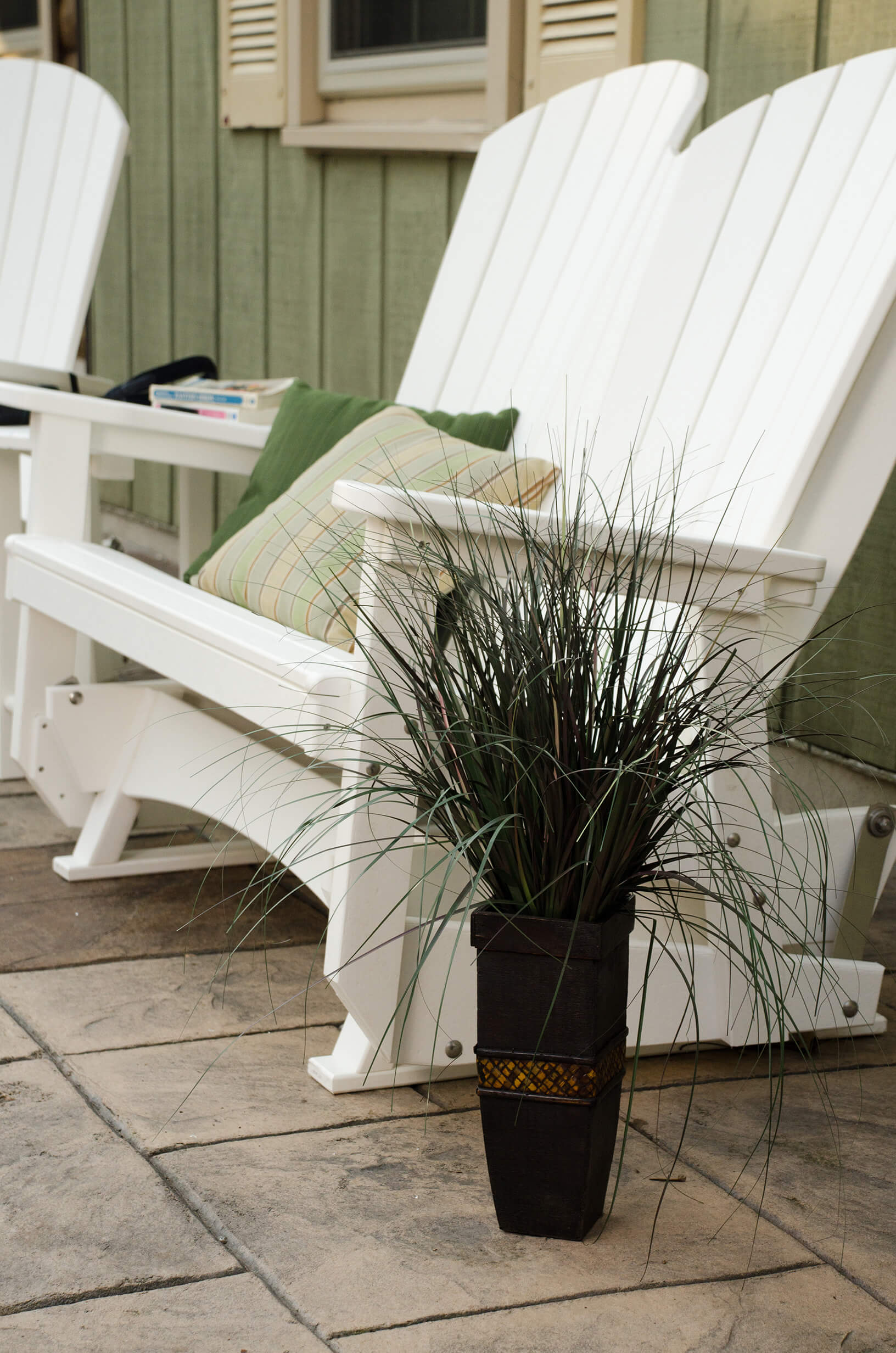 Adirondack glider Adirondack glider in white on the porch.