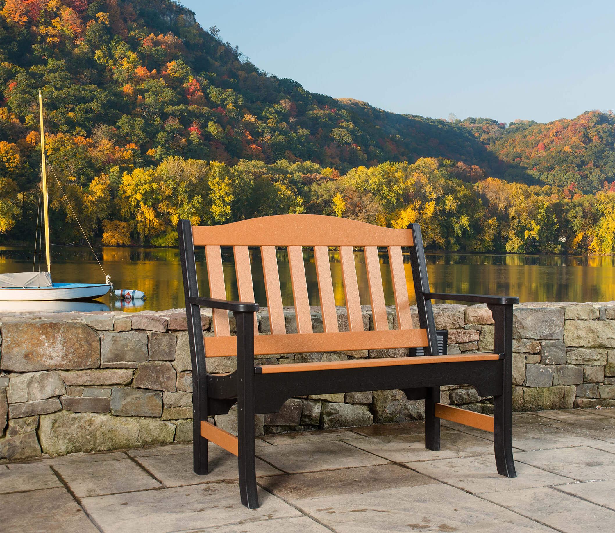 Bench Bench by a stone wall with the lake in the background.