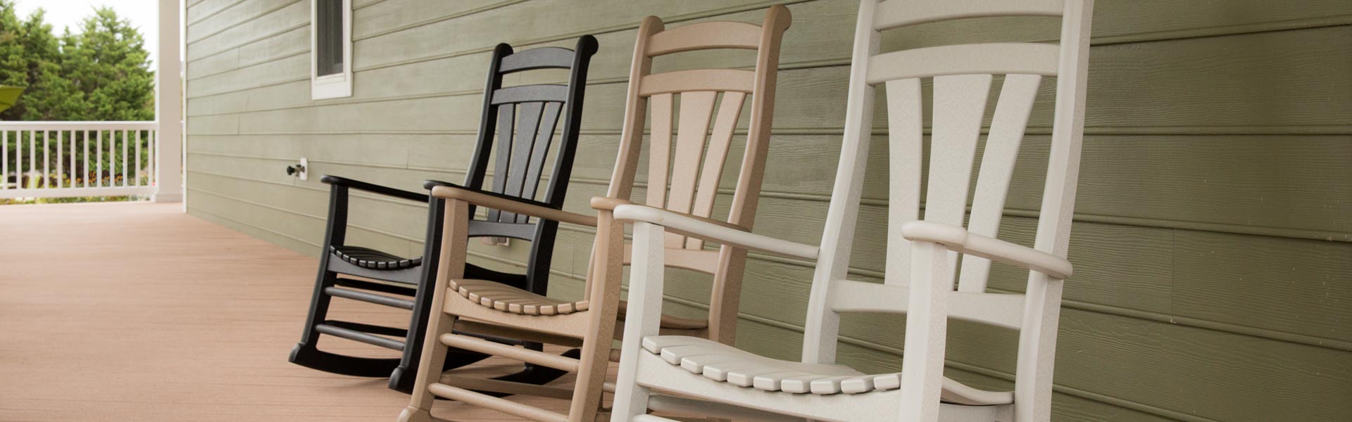 Rockers Three porch rockers in brown, light brown, and white.